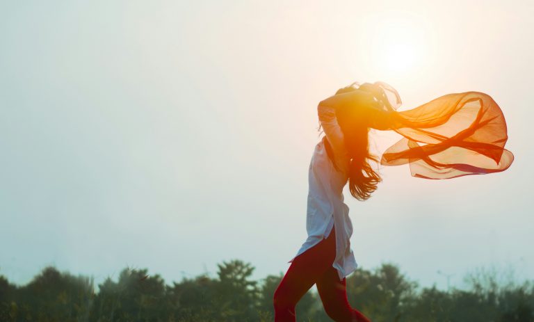 Woman running with scarf