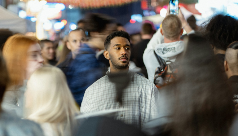 man in crowded train station